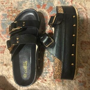 Platform Birkenstock styled sandals black and gold size 9
